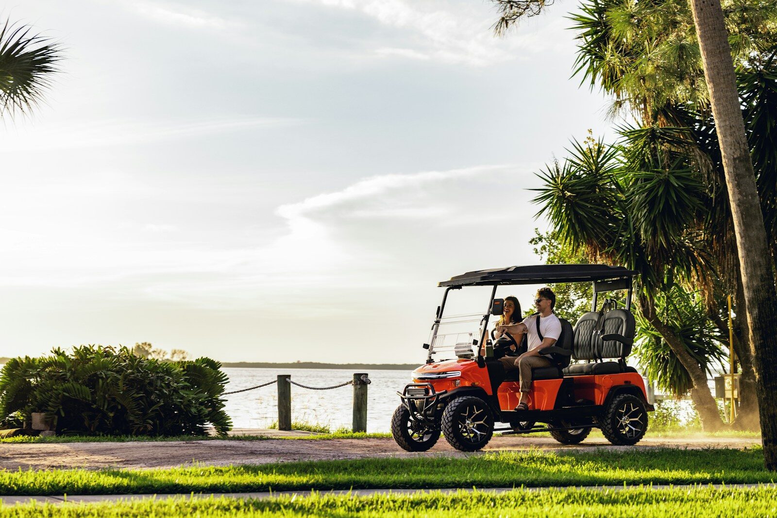 A group of people riding on a golf cart